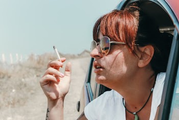 Photo Of Woman Smoking Cigarette