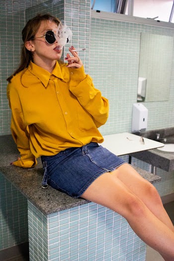 Photo Of Woman Smoking Cigarette
