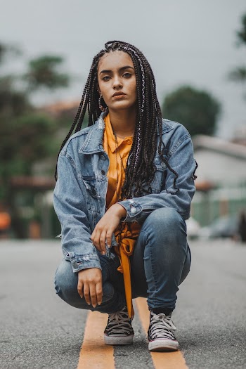 Photo of Woman Squat Posing in The MIddle of the Road