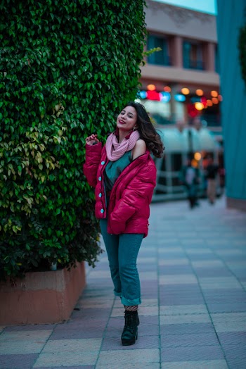 Photo of Woman Standing Beside Bush