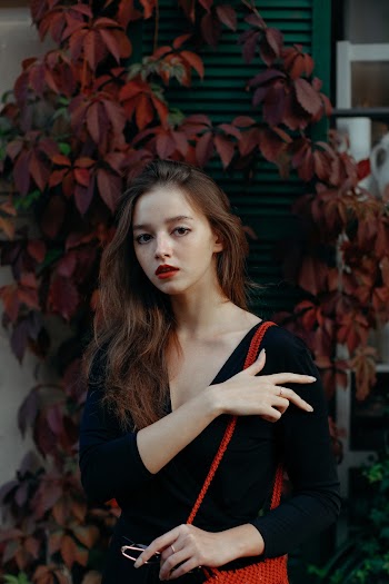 Photo Of Woman Standing Beside Bushes