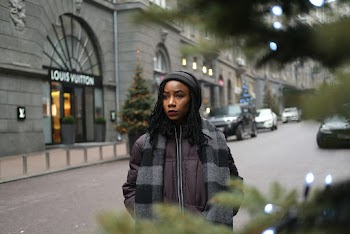 Photo of Woman Standing Beside Road