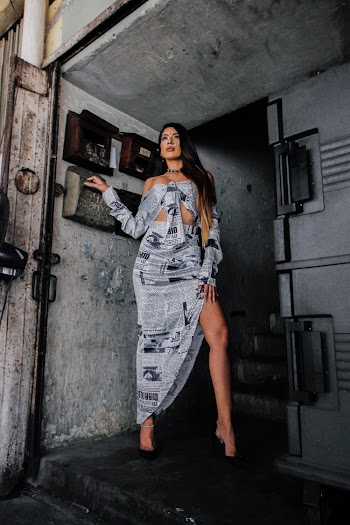 Photo Of Woman Standing Beside Wall