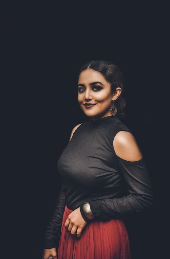 Photo of Woman Standing in Black Background