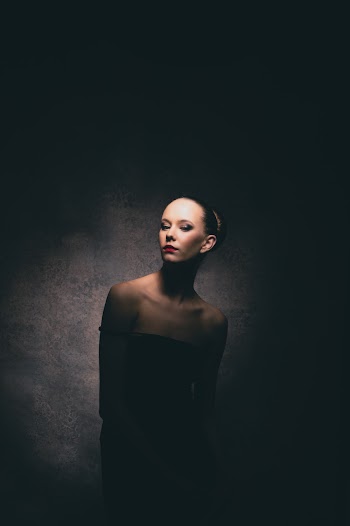 Photo Of Woman Standing In The Dark