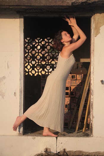Photo Of Woman Standing In The Doorway