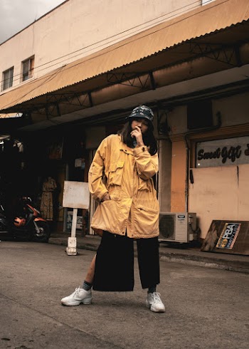 Photo of Woman Standing in the Street Posing