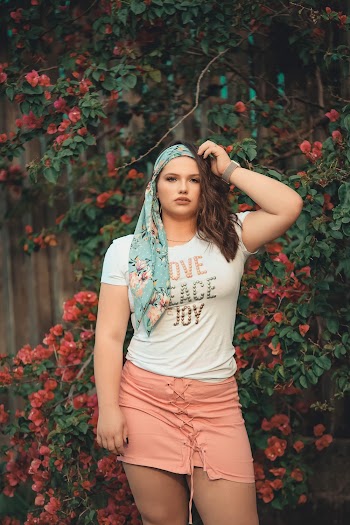 Photo of Woman Standing Near Bougainvillea Flowers Posing