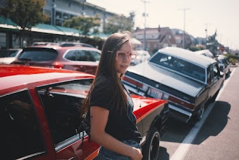 Photo Of Woman Standing Near Car