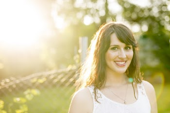 Photo of Woman Standing Near Chain-Link Fence