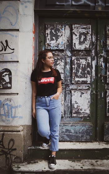 Photo Of Woman Standing Near Door