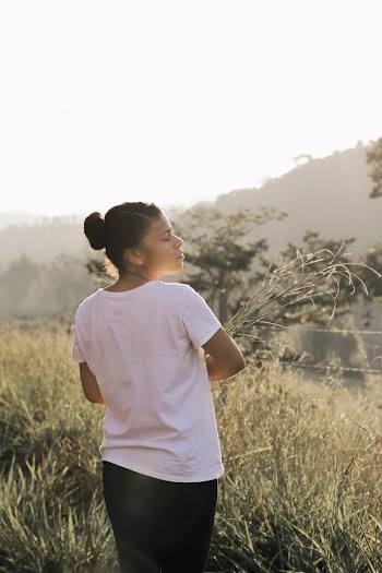 Photo of Woman Standing Near Grass