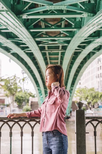 Photo Of Woman Standing Near Handrail