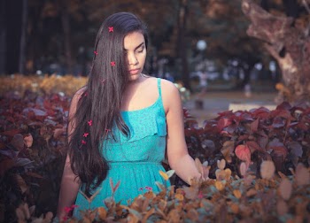 Photo of Woman Standing Near Plants