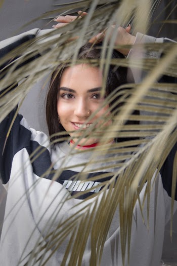 Photo Of Woman Standing Near Plants