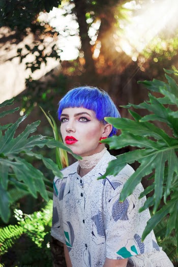 Photo of Woman Standing Near Plants