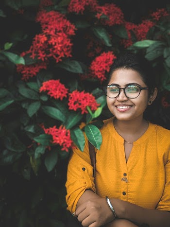 Photo Of Woman Standing Near Plants