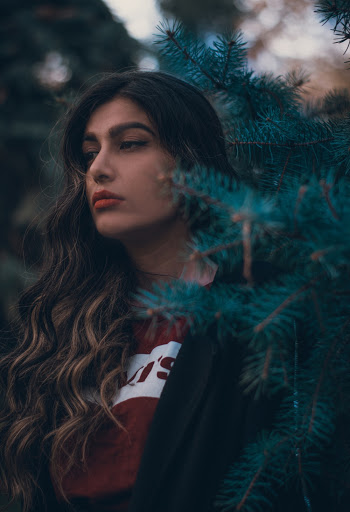 Photo Of Woman Standing Near Plants