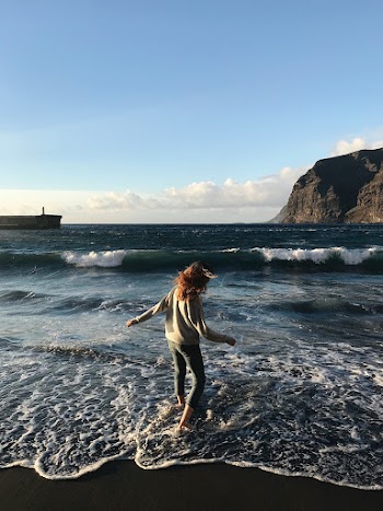 Photo of Woman Standing Near Seashore