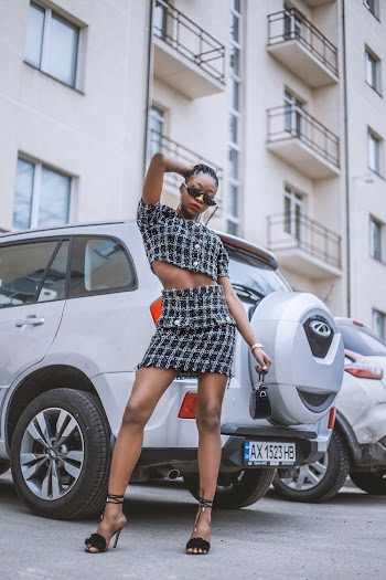 Photo of Woman Standing Near Vehicle