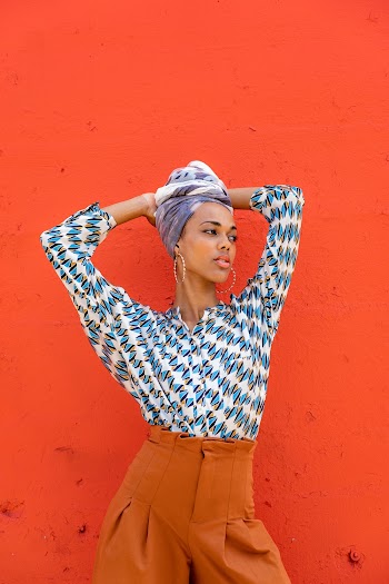 Photo of Woman Standing Near Wall