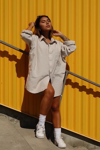 Photo Of Woman Standing Near Wall