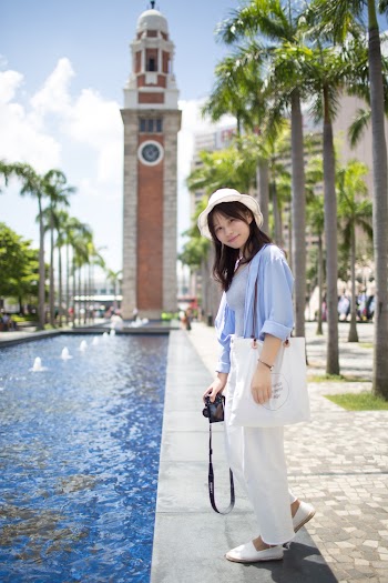Photo of Woman Standing Near Water Fountain