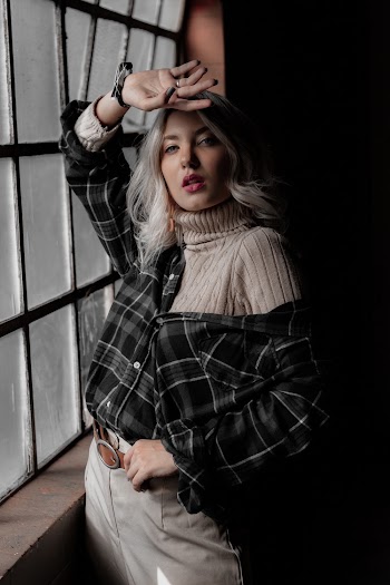 Photo Of Woman Standing Near Window