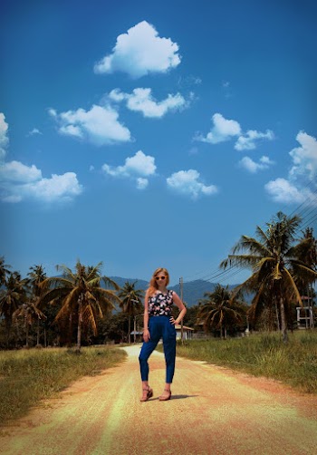 Photo of Woman Standing On Dirt Road