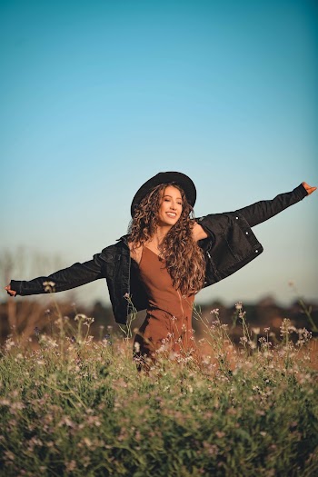 Photo Of Woman Standing On Field