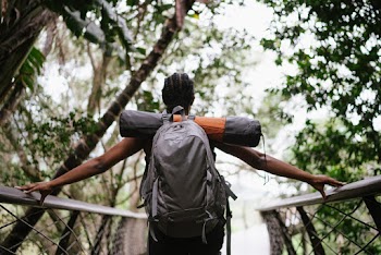 Photo Of Woman Standing On Foot Bridge 