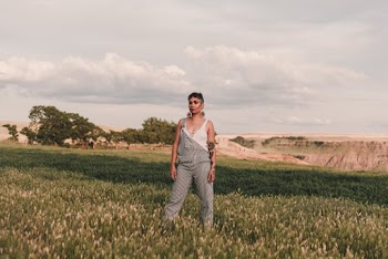 Photo Of Woman Standing On Grass Field