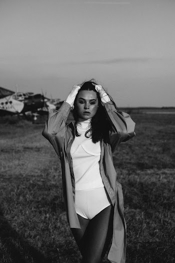 Photo Of Woman Standing On Grass Field