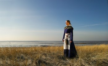 Photo of Woman Standing on Grass Field