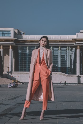 Photo of Woman Standing on Pavement
