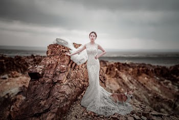 Photo of Woman Standing on Rock Formation