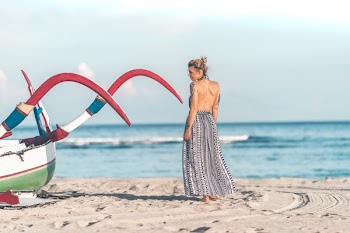 Photo of Woman Standing on Seashore