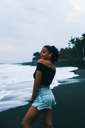 Photo of Woman Standing on Seashore