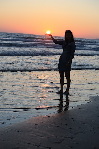 Photo of Woman Standing On Seashore