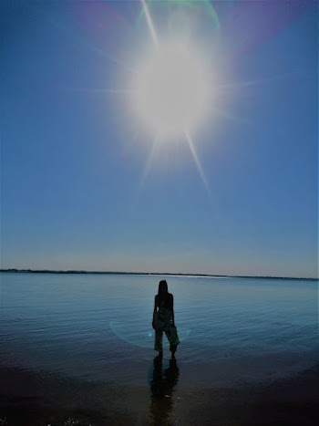 Photo Of Woman Standing On Shallow Water