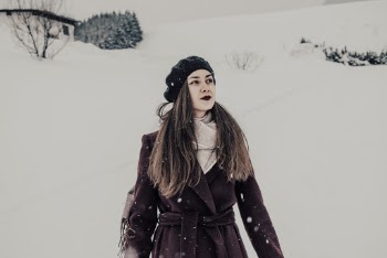 Photo Of Woman Standing On Snow