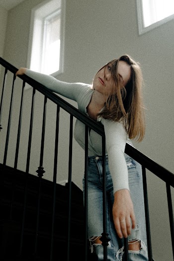 Photo Of Woman Standing on Stairs