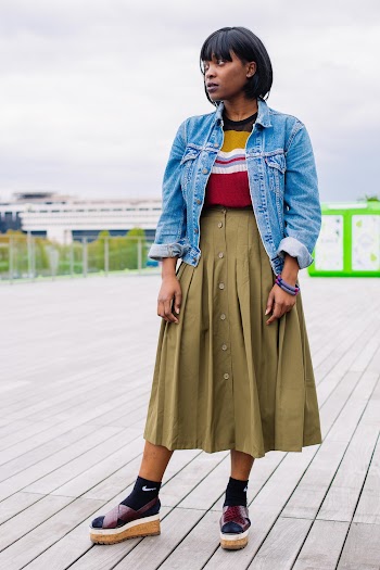 Photo of Woman Standing Wearing Denim Jacket
