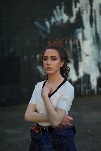 Photo of Woman Standing While Wearing White Shirt