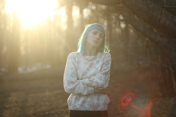 Photo of Woman Standing with Her Arms Crossed