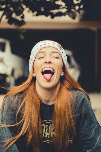 Photo Of Woman Sticking Her Tongue Out