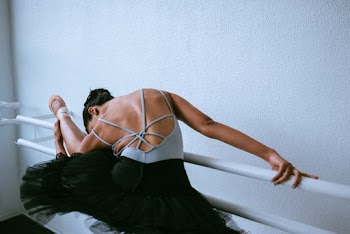 Photo of Woman Stretching Her Leg