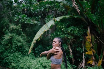 Photo Of Woman Stretching Near Plants