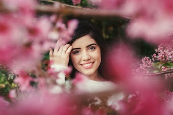 Photo of Woman Surrounded With Pink Flowers