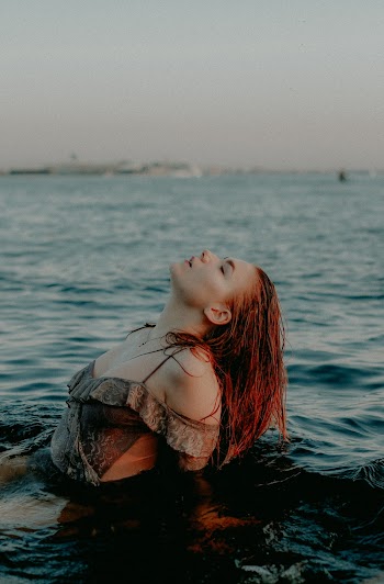 Photo Of Woman Swimming In The Sea